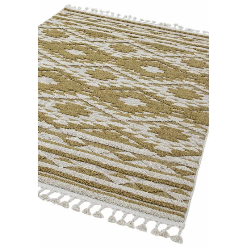 Beige and cream patterned rug with geometric design and tasselled edges