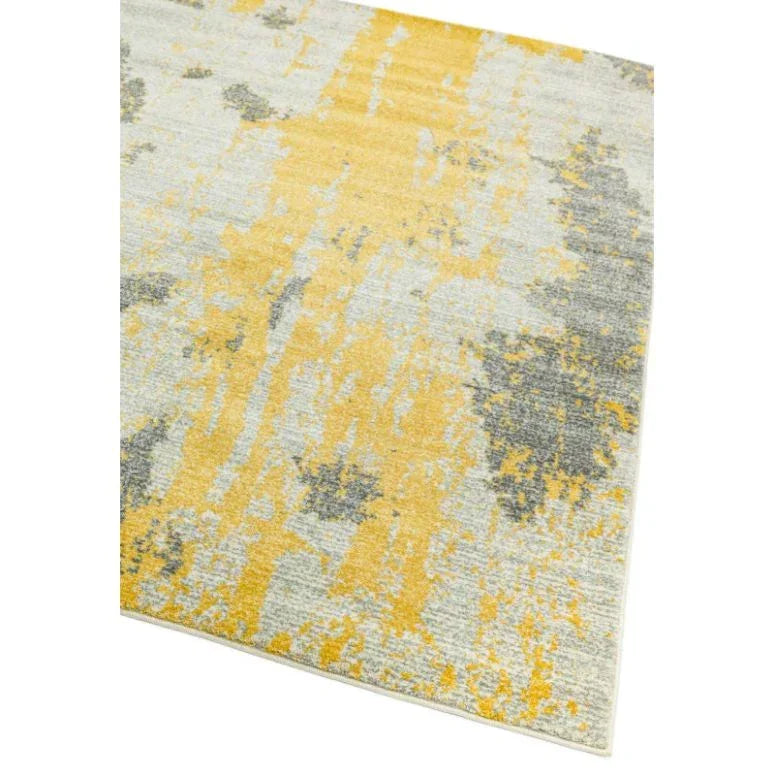 Yellow and grey abstract area rug with textured modern pattern, corner angled view