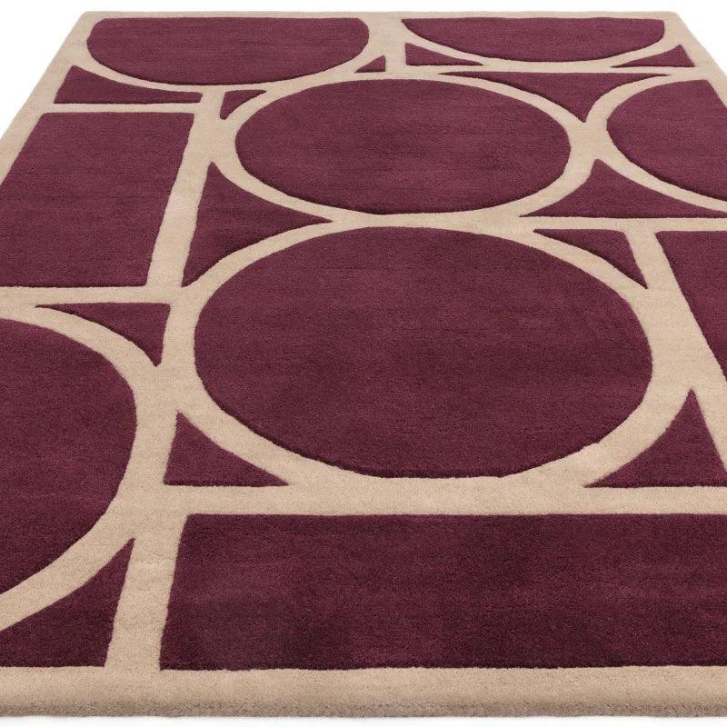 Plum and beige geometric area rug with large circles and rectangles pattern