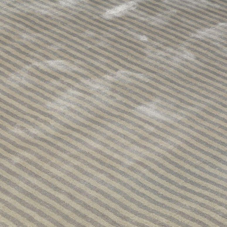 Beige and grey striped rug pattern with soft texture and subtle sheen