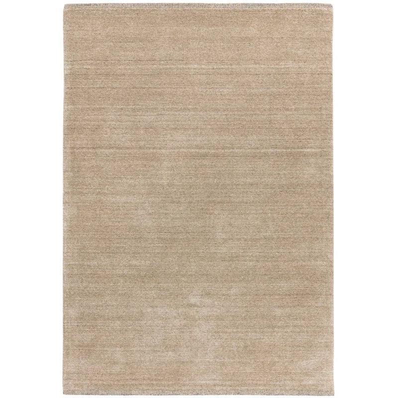 Beige area rug with subtle texture and simple rectangular design