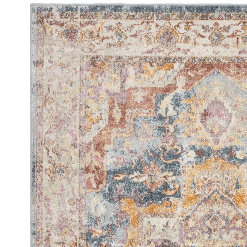 Corner of multicolored patterned area rug with ornate vintage design