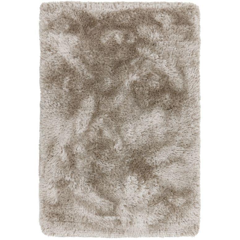 Beige shaggy rug with thick pile and soft texture, top view