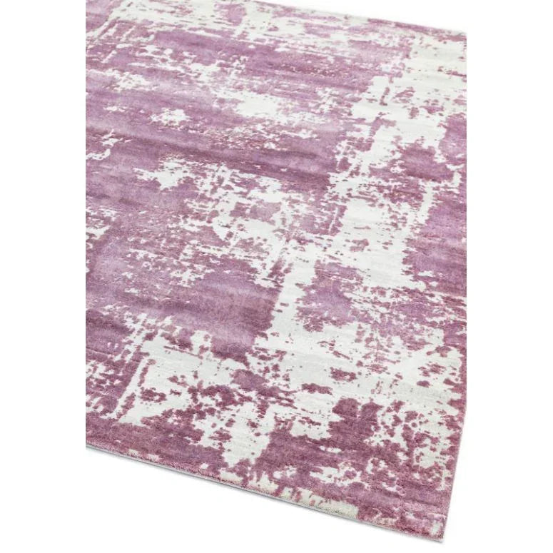 Abstract pink and white area rug with textured pattern and soft surface