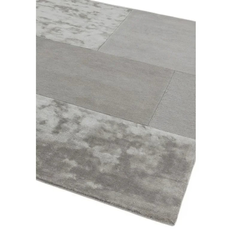 Grey modern area rug with mixed texture panels and rectangular block pattern