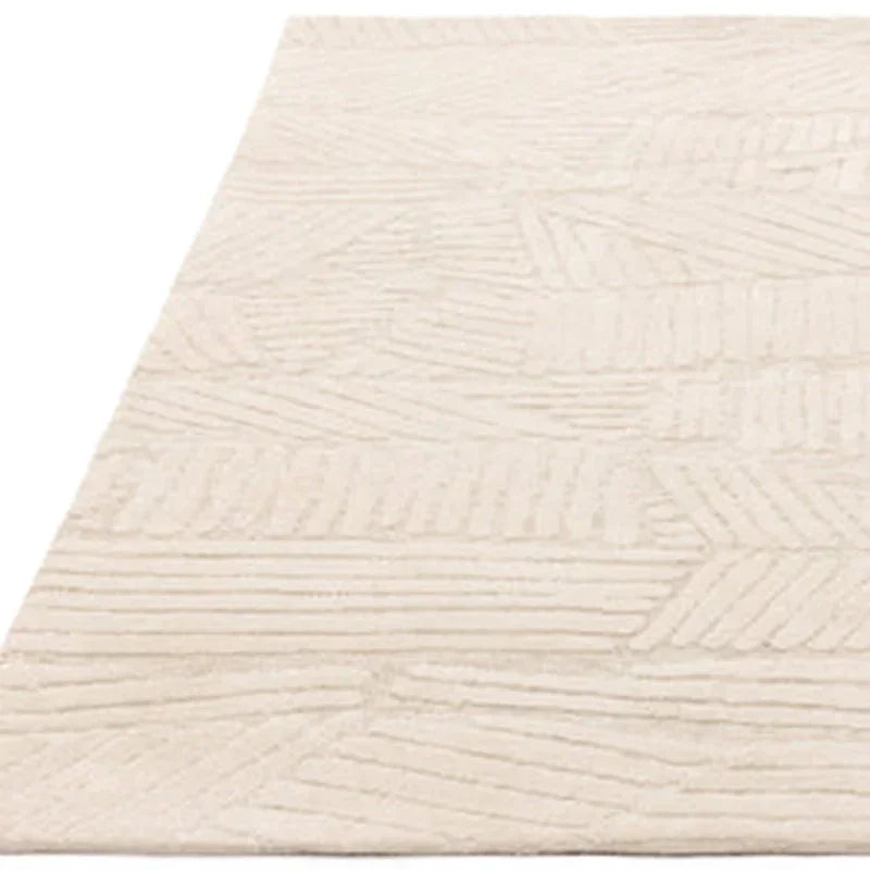 Beige textured area rug with geometric pattern and low pile