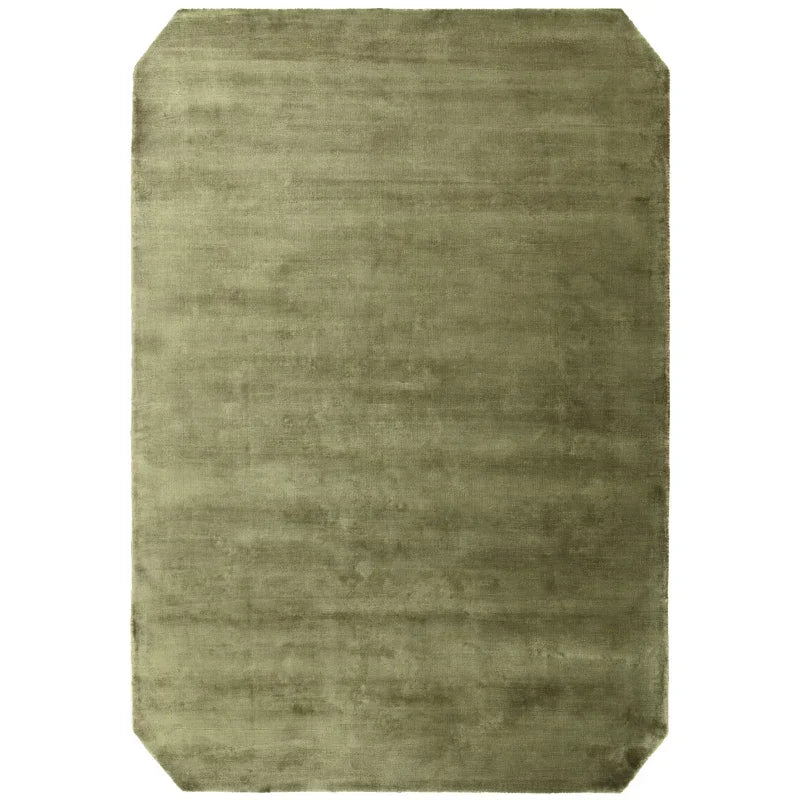 Olive green rectangular area rug with angled corners and soft textured surface