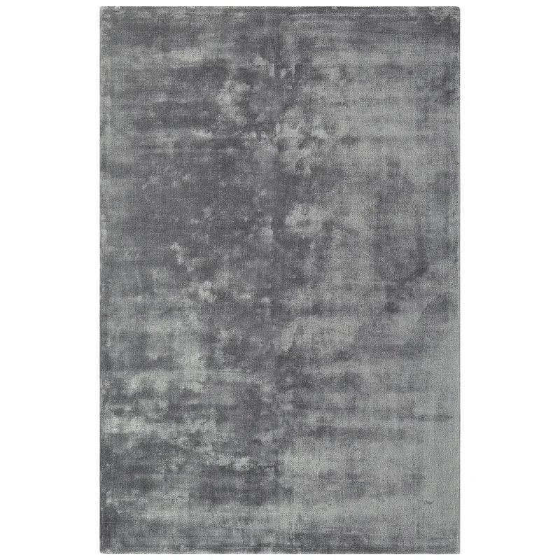 Rectangular grey area rug with soft textured surface and subtle tonal pattern