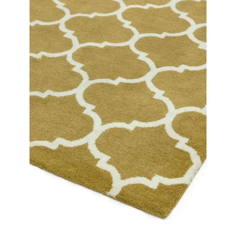 Beige area rug with white lattice pattern and plush texture corner view