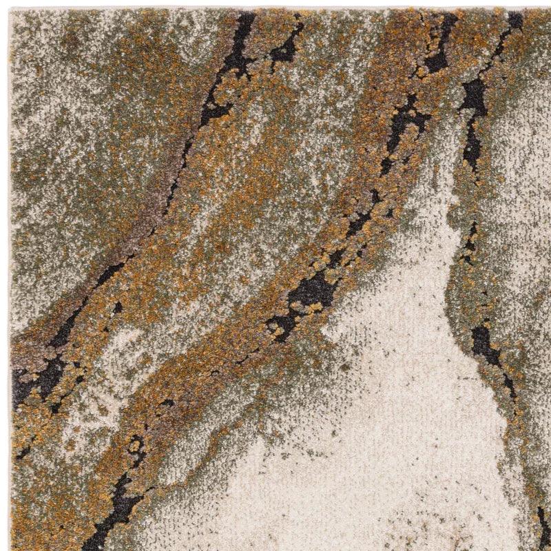 Abstract pattern area rug with beige, gold, and grey tones, close-up texture view