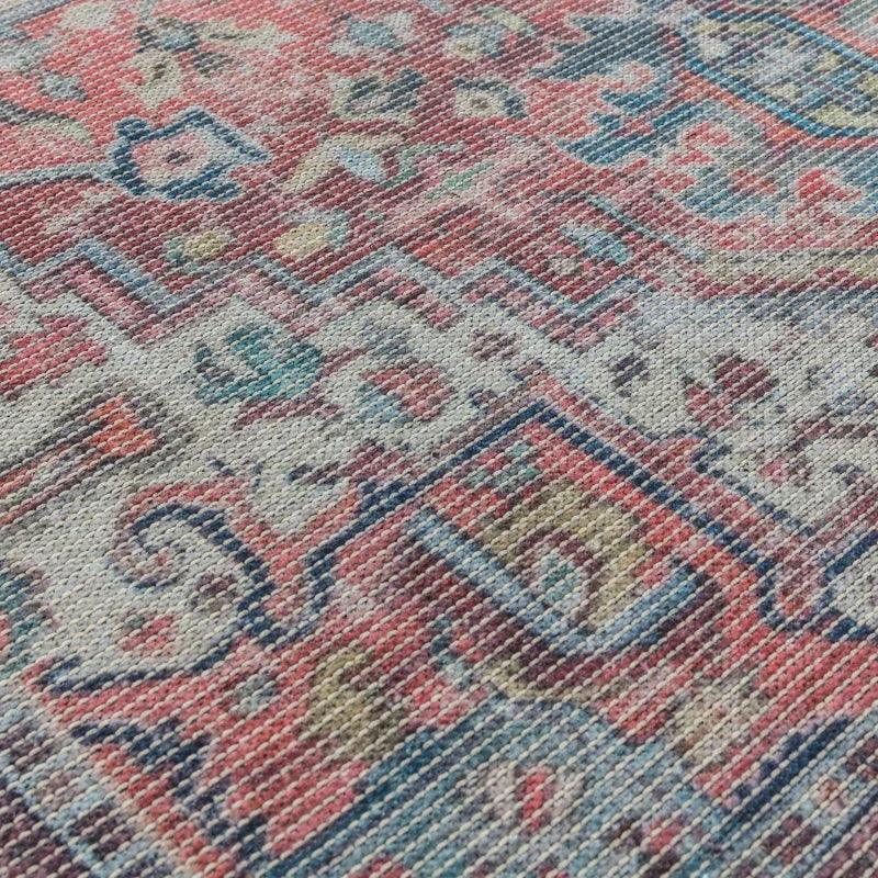 Close up of multicoloured woven rug with vintage geometric pattern and textured fabric