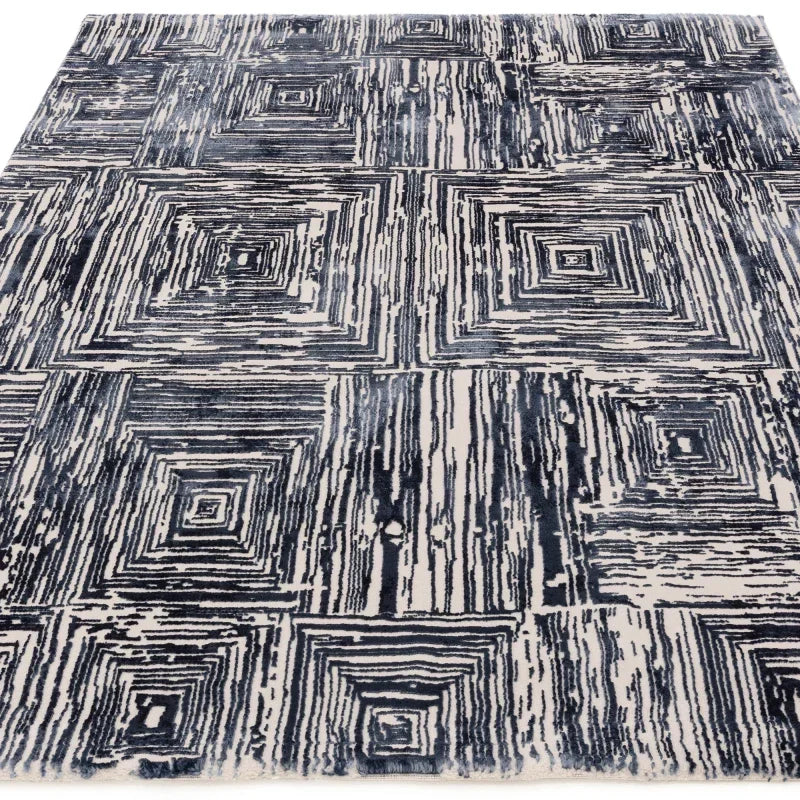 blue and cream geometric patterned area rug with square designs