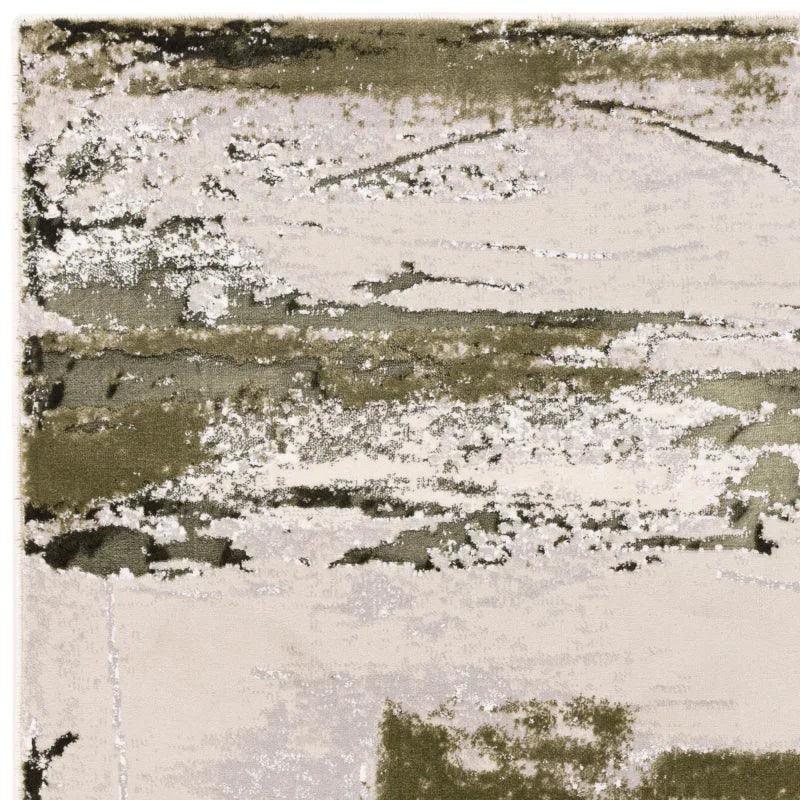 Modern abstract area rug with cream and olive green pattern, close-up texture view