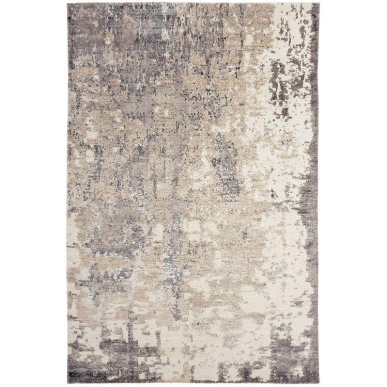 Beige and grey abstract patterned area rug with textured finish