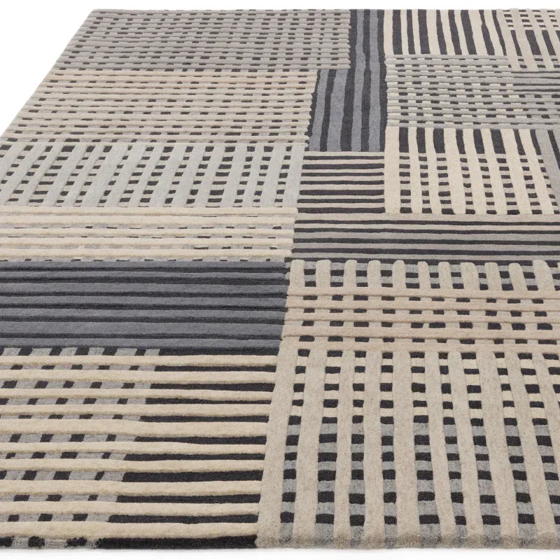 Beige and grey geometric patterned rug with intersecting lines and textured design