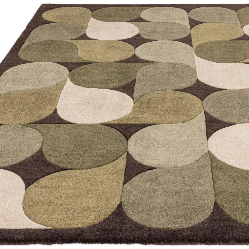 Geometric patterned area rug in beige, olive, and brown tones with modern design