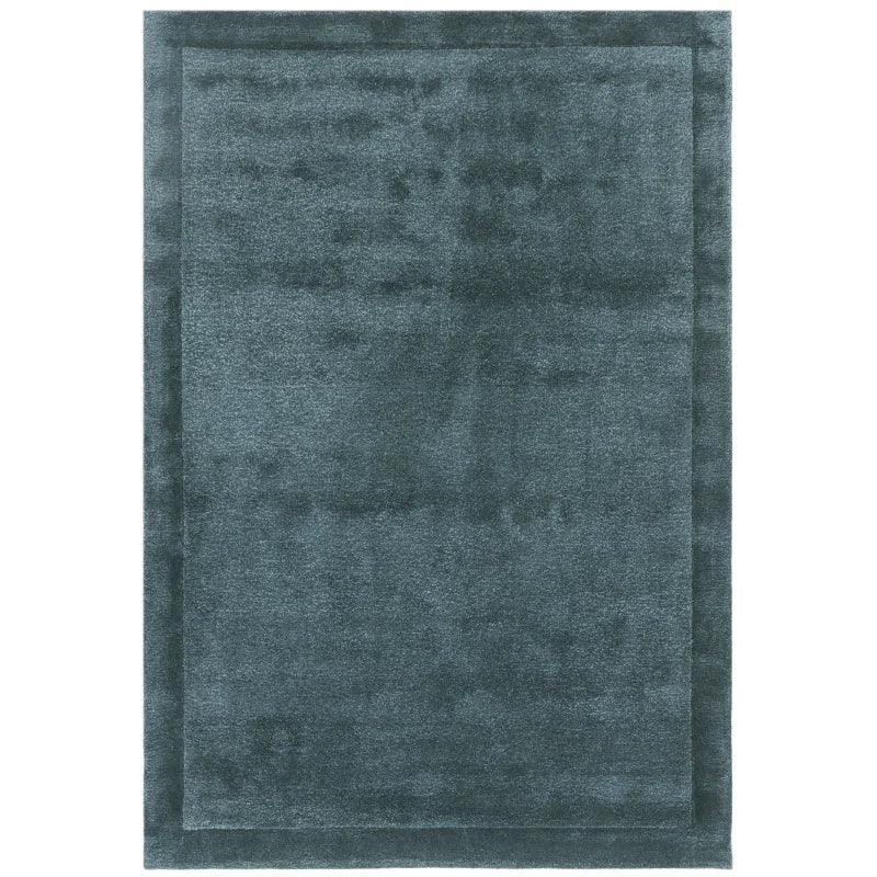 Large rectangular blue grey area rug with subtle border design