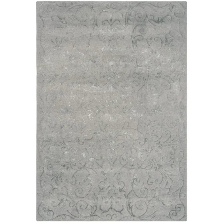 Light grey patterned rug with subtle scroll design and textured surface