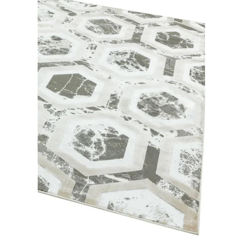 Modern area rug with grey geometric hexagon pattern on cream background