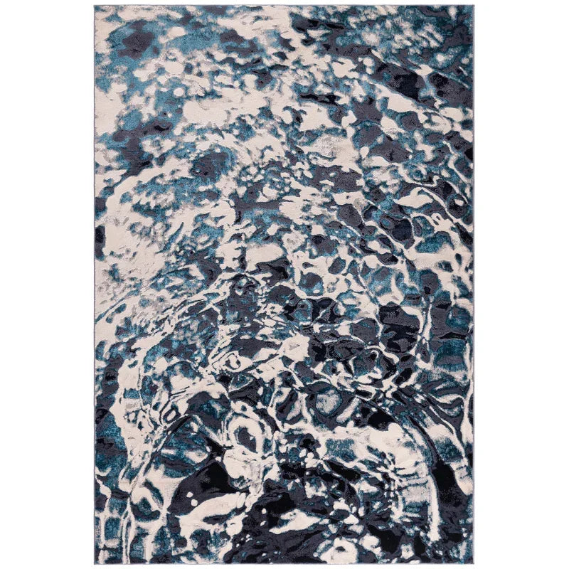 Blue and grey abstract area rug with water ripple pattern