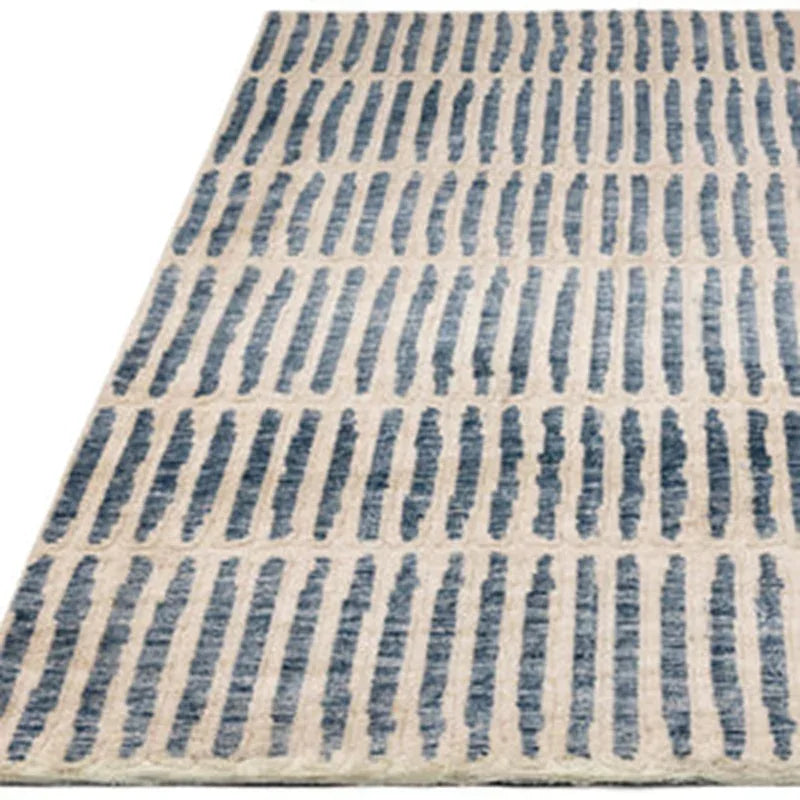 Beige area rug with blue striped pattern for living room or bedroom floor decor