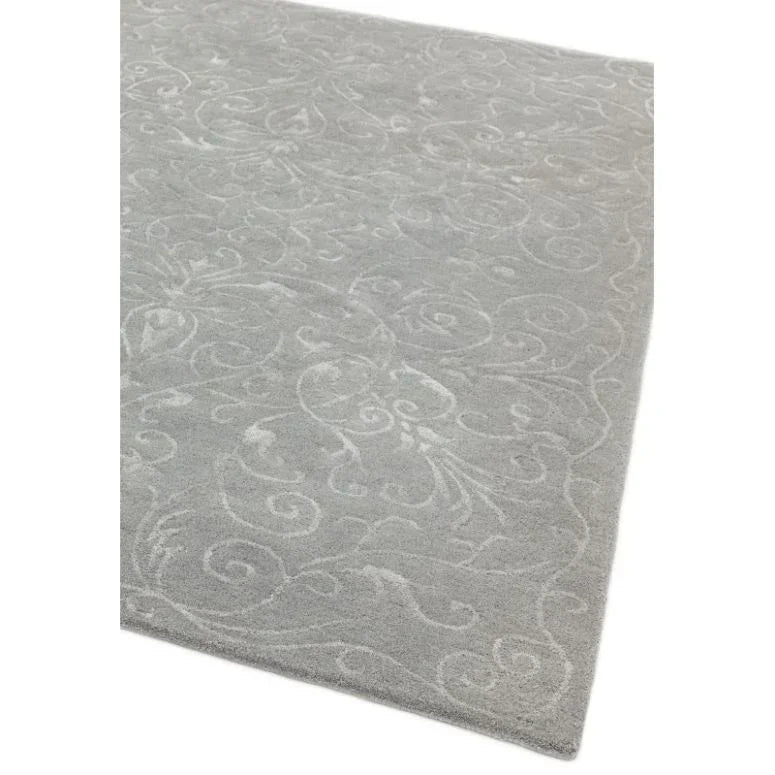 Light grey patterned rug with subtle floral details and soft textured finish