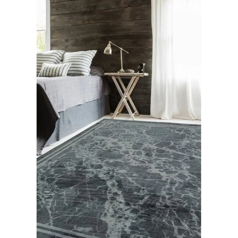 Grey marble effect rug in modern bedroom with wooden panel wall and bedside table
