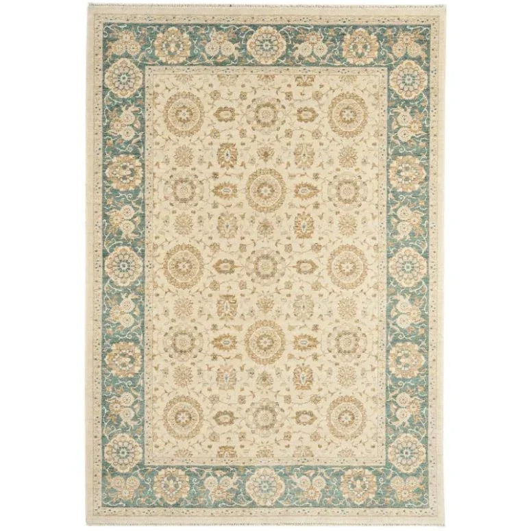 Cream and blue patterned area rug with floral border and intricate central design