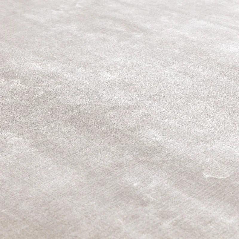 Close up of light grey velvet rug texture