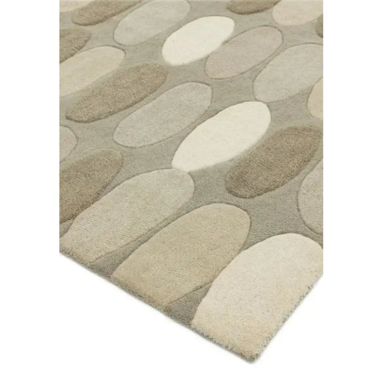 Beige and grey wool rug with oval stone pattern and textured surface