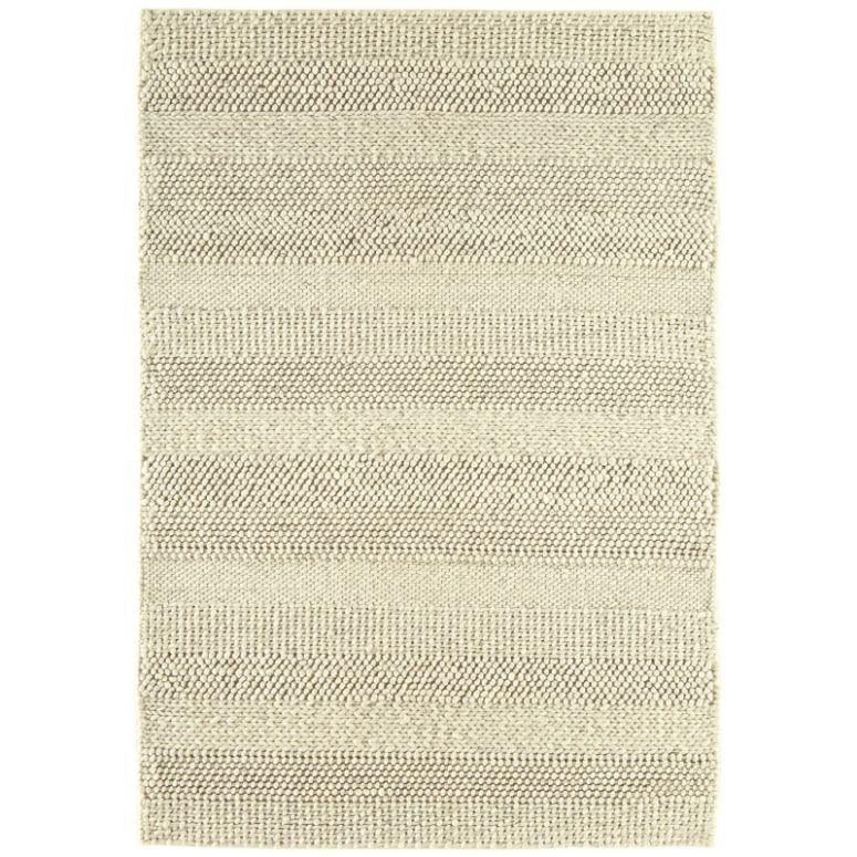 Beige striped woven rug with textured pattern, flat lay view