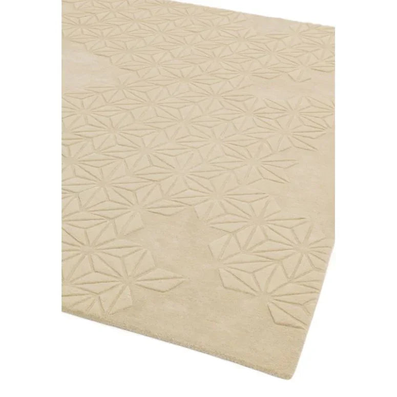 Beige geometric pattern rug with textured design, close corner view