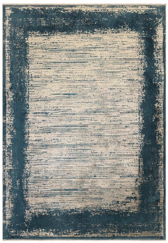 Blue and beige area rug with distressed border and textured striped center design