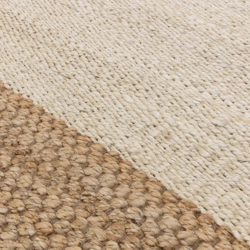Textured wool and jute rug in natural and cream tones, close-up of woven pattern