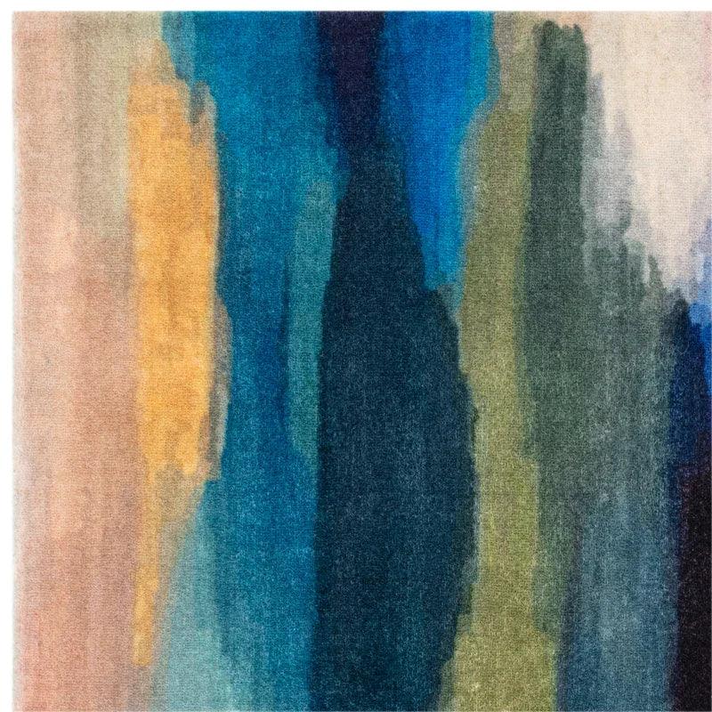 Modern area rug with abstract blue, green, and yellow gradient pattern