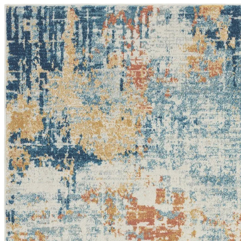 Abstract area rug with blue, gold, and rust pattern on cream background