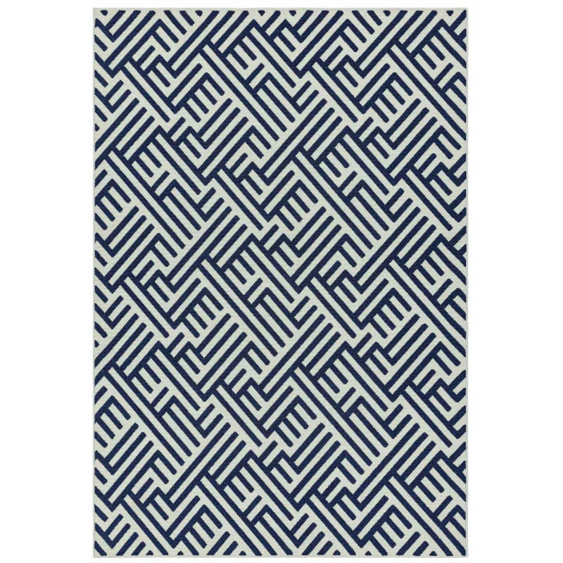 Navy geometric patterned rug with white background, modern home décor accessory
