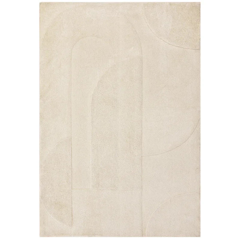 Cream area rug with subtle geometric patterns and raised texture