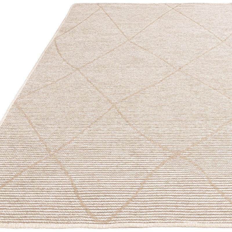 Beige area rug with subtle linear and diamond pattern, close up of textured surface
