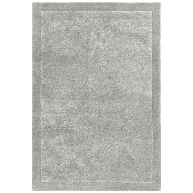 light grey rectangular area rug with subtle border design