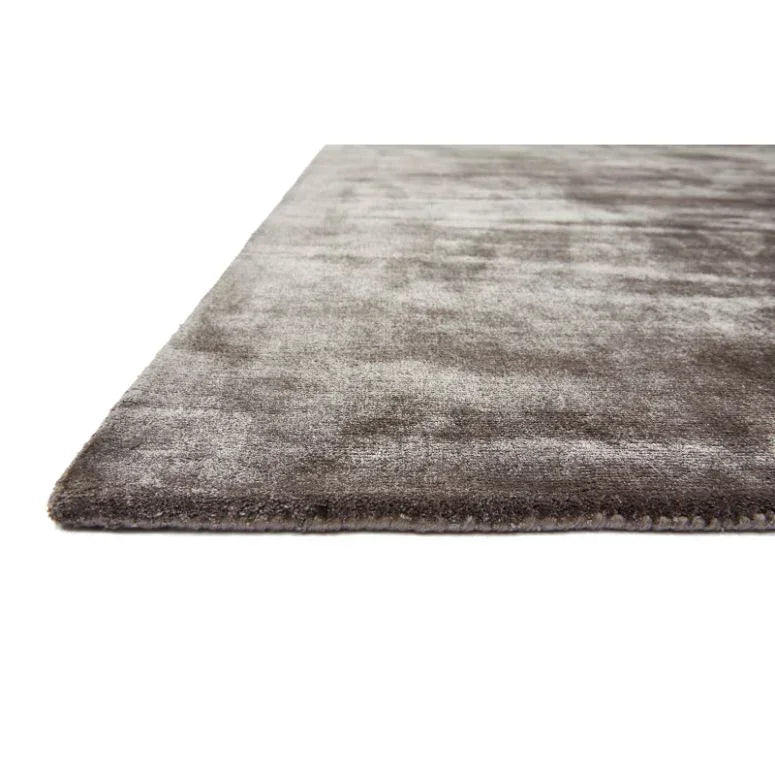 Grey velvet area rug close-up showing soft texture and low pile design