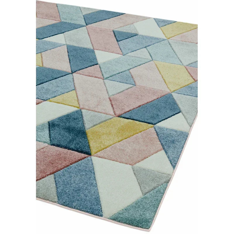 Geometric rug with pastel blue, pink, and yellow triangles on soft pile