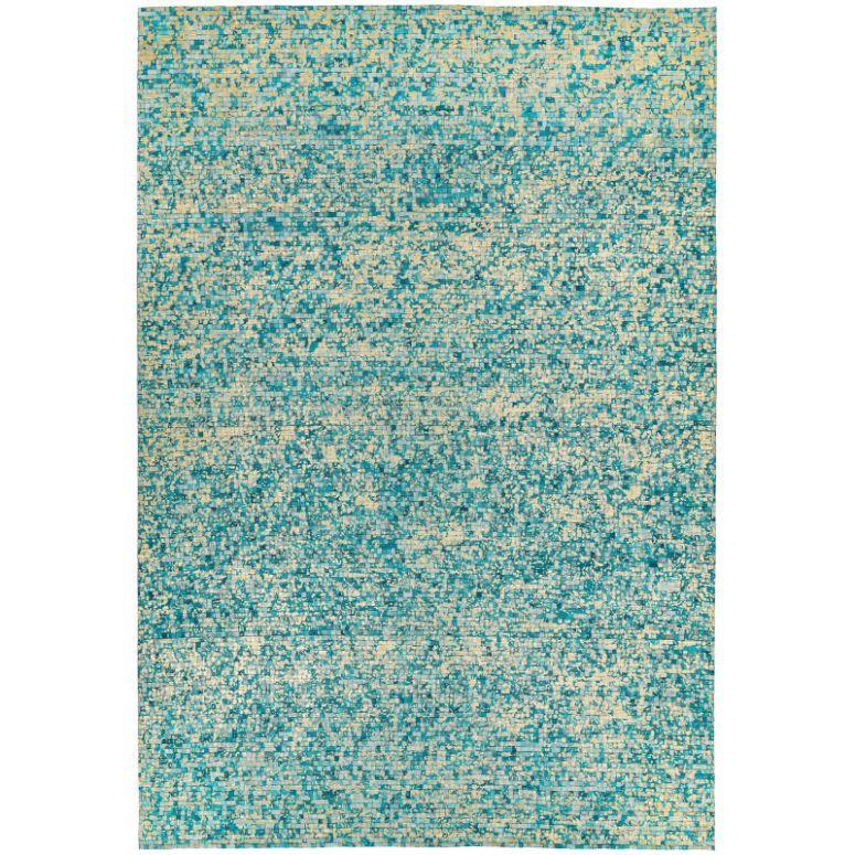 Blue and beige abstract area rug with textured pattern on a white background