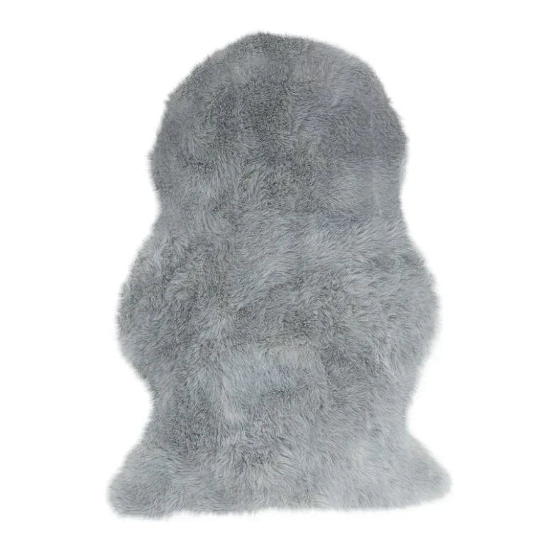 Grey faux fur rug with thick pile and irregular shape on white background