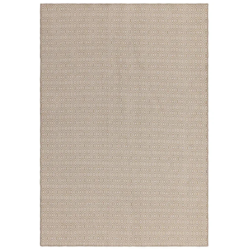 Beige geometric pattern rug with hexagon design, viewed from above