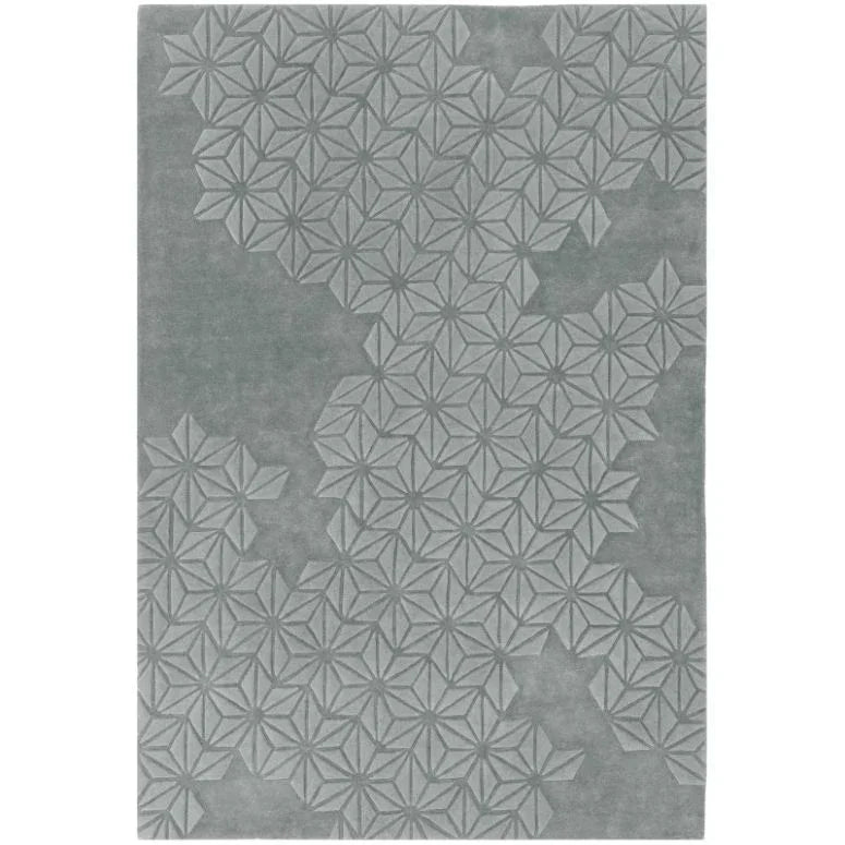 Grey geometric pattern rug with embossed star shapes and textured finish