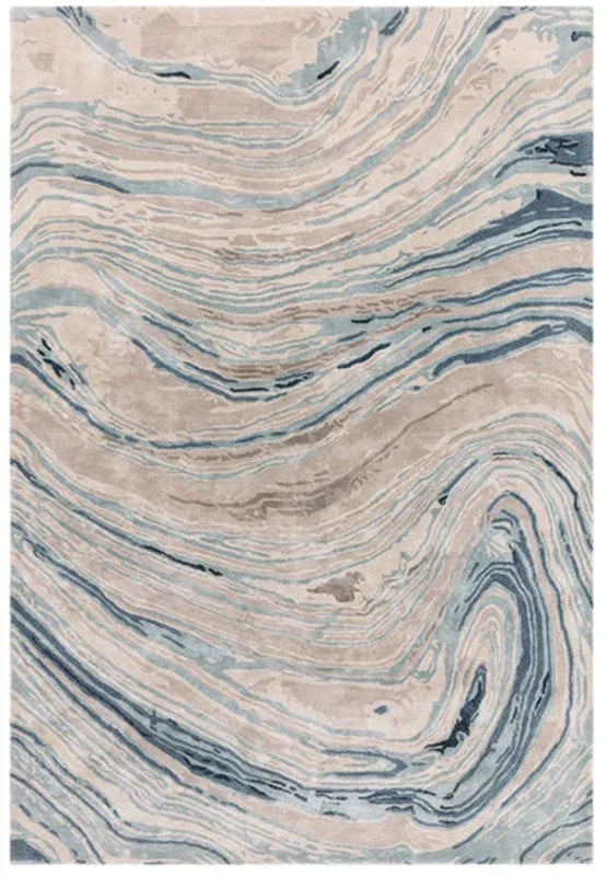 Modern area rug with abstract blue and beige wave pattern