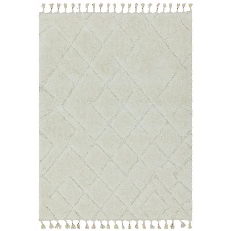 Cream area rug with subtle diamond pattern and tassel fringe on both ends