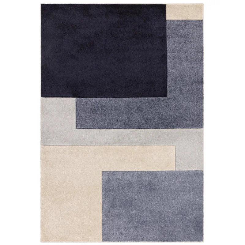 Modern area rug with geometric pattern in navy, grey and cream blocks