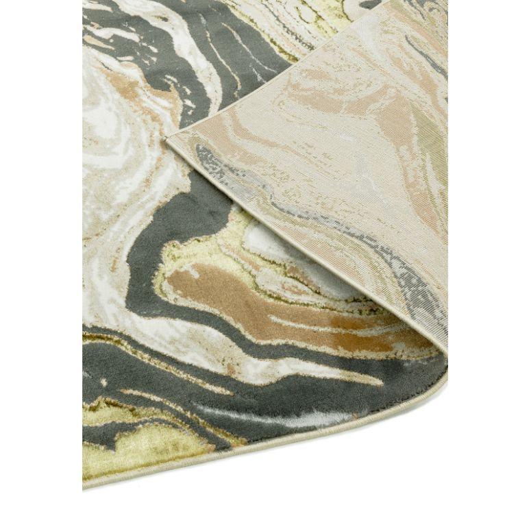 Abstract pattern area rug in grey, beige, and gold with soft textured pile